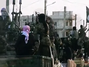 A screen shot of a Daesh propaganda video shot last March shows militants riding on tanks through the northern Syrian city of Homs, experts say the use of children in the most recent videos reflects a drastic change in direction. (AFP/File)