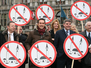 Members of several European right wing parties pose with signs, after the presentation of their organisation of 'Cities against Islamisation' in Antwerp. (AFP/Jorge Dirkx) 