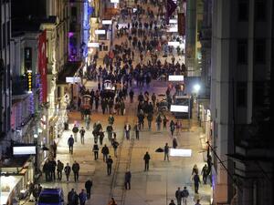 Pedestrians walk down Istiklal Street, a busy shopping and entertainment hub in central Istanbul, on March 20, 2016, a day after a suicide attack. (AFP/Yasin Akgul)