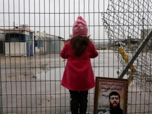 A Palestinian girl stands outside an Israeli jail. (AFP/File Photo)