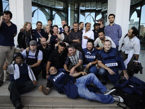 Journalists celebrate after being held hostage in Libya during the 2011 uprising. (AFP/File)