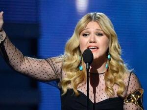 Kelly Clarkson reacts on stage as winning the Best Pop Vocal Album during the 55th Grammy Awards in Los Angeles. (AFP/File)