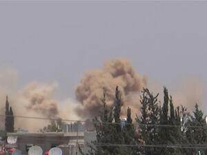 Screenshot taken from Youtube of Khan al-Shih being hit by barrel bombs. (YouTube) 