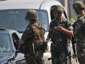 Lebanese soldiers stop vehicles to perform routine checks at a military checkpoint. (AFP/File)