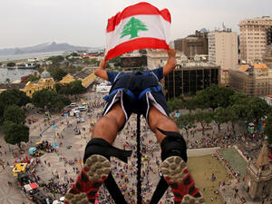 A Lebanon fan makes a bungee jump from a 45-meter-tall platform at Boulevard Olimpico, in Rio de Janeiro. (AFP/File) 