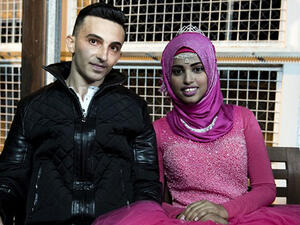 A Palestinian refugee from Lebanon and a Yemeni refugee pose for a photo during their engagement party at the Kofinou centre for refugees near the Cypriot coastal city of Larnaca. (AFP/File)