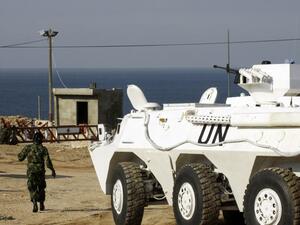 United Nations Interim Force in Lebanon (UNIFIL) troops stand guard at the Ras al-Naqura checkpoint on the Lebanese-Israeli border on December 16, 2013 following crossfire between Israeli and Lebanese forces the previous evening. [AFP]
