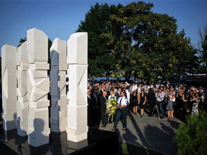 Relatives and officials pay respect on July 18, 2013 to a memorial dedicated to the five Israeli and one Bulgarian victims of a suicide blast which targeted on July 18, 2012 a bus of Israeli tourists at Burgas airport, southeast Bulgaria. A year after, Bulgaria is struggling to identify the attacker or confirm his suspected links to Hezbollah or Iran. (NIKOLAY DOYCHINOV/AFP/Getty Images)