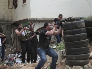 Gunmen fire during clashes between supporters and opponents of the Syrian government in northern Lebanon. [presstv]