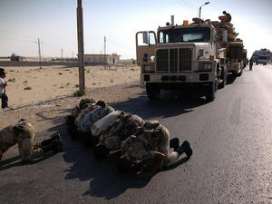Egyptian soldiers pray as they are deployed in the northern Sinai town of Al-Arish on July 16, 2013. (Source: AFP/STR)