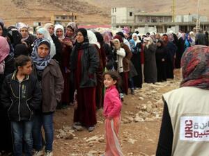 Syrian refugees await assistance in Lebanon. (AFP/File)