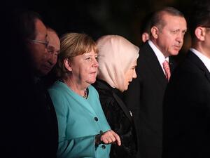German Chancellor Angela Merkel (3rd L), Russia's President Vladimir Putin (2nd L), and Turkey's President Recep Tayyip Erdogan (R) are seen as G20 leaders and their spouses walk for a group picture prior to a dinner banquet at the G20 Summit in Hangzhou on September 4, 2016. (AFP/Johannes Eisele)