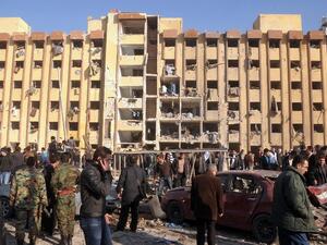Syrian's gather at the scene of an explosion outside Aleppo University, between the university dormitories and the architecture faculty, on Tuesday. (AFP PHOTO/STR)