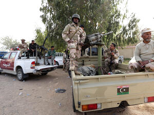 The British defense secretary is in Libya trying to sell arms to the country after its decision to upgrade the military 