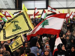 ebanese women loyal to Hezbollah wave the national flag and Hezbollah flags during a gathering to mark the "Al-Quds (Jerusalem) International Day" from Beirut's southern suburb neighbourhood of Rweiss on August 2, 2013. (AFP)