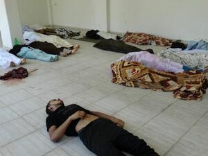 Bodies are laid out on the ground at a makeshift morgue as Syrian rebels claim they were killed in a toxic gas attack by pro-government forces in eastern Ghouta, on the outskirts of Damascus on August 21, 2013(AFP PHOTO / HO / SHAAM NEWS NETWORK)