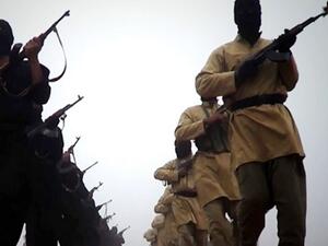 An image grab taken from a video released on January 4, 2014 by the Islamic State of Iraq and the Levant (ISIL)'s al-Furqan Media allegedly shows ISIL fighters marching at an undisclosed location. [AFP]