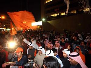 Kuwaiti opposition supporters demonstrate in downtown Kuwait City late on Saturday night, to demand dissolution of the new parliament. (AFP PHOTO/YASSER AL-ZAYYAT)
