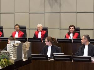 Four Hezbollah members went on trial in absentia at a UN-backed tribunal accused of murdering Hariri in a 2005 car bombing, with sectarian tensions running high at home. [AFP]