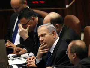 Israeli Prime Minister Benjamin Netanyahu (C) attends a special Knesset (Israeli parliament) session in Jerusalem. (TOPSHOTS/AFP PHOTO/GALI TIBBON)