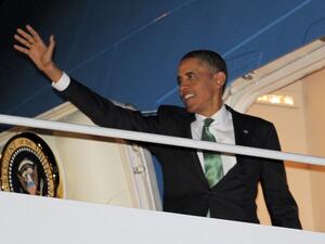 U.S. President Barack Obama makes his way to board Air Force One on Tuesday at Andrews Air Force Base in Maryland. (AFP PHOTO/Mandel NGAN)