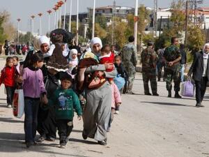 Approximately 3,000 women and children from Mouadamiya have managed to leave the besieged town according to UN figures (Khaled al-Hariri/Reuters)
