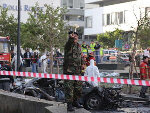 Lebanese security forces inspect the scene of a huge car bomb explosion that rocked central Beirut on December 27, 2013, killing Mohamed Chatah. [AFP]