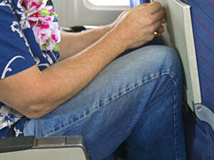 Riding like this in an airplane can do more than make you grumpy--it could kill you!