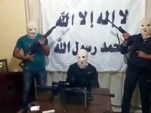 A screengrab taken from a video released on You Tube on August 15, 2013 allegedly shows three armed and masked members of a previously unknown Syrian rebel group that claimed responsibility for the blast in the Lebanese capital Beirut. (AFP/YouTube)
