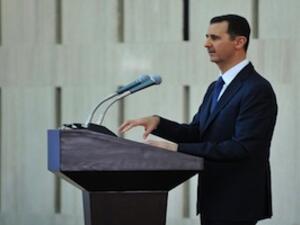 President Bashar Assad gives speech at an "iftar" meal on the last week of the Muslim holy month of Ramadan with political and religious figures in Damascus on August 4, 2013. (AFP)