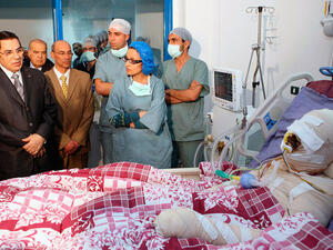 Stately visit from then President Zine El Abidine Ben Ali to Mohamed Bouazizi, who burned himself in protest sparking the 
Arab Spring. This picture was taken before Ben Ali fled to Saudi. (Image courtesy of "womenslens.blogspot.com")