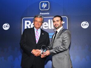 Cesare Cardone, CEO of GBM, accepts the award on behalf of the company