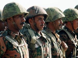 Egyptian soldiers stand at attention.
