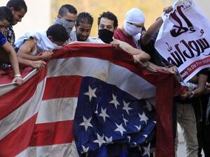 Egyptian protestors tore down the American flag and hung and Islamic one in its stead.