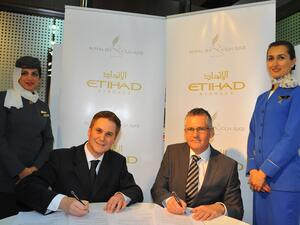 Peter Baumgartner, Etihad’s Chief Commercial Officer and Shane O’Hare, Chief Executive Officer of Royal Jet signing the MoU