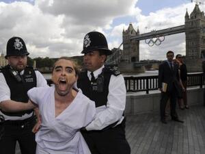 Arresting members of FEMEN during the protest