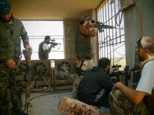 AFP PHOTO / HO / SHAAM NEWS NETWORK: The FSA in Damascus