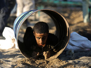  A Palestinian youth crawls through a tunnel during a summer physical training camp run by Hamas in Gaza City on June 21, 2013. (Source: AFP/MOHAMMED ABED)