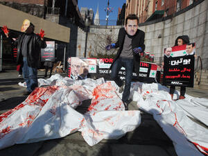 Shown for illustrative purposes- Demonstrating actors in New York, speaking out against Bashar and Putin.
