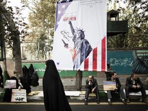 A UN official speaking at the P5+1 Geneva conference said the world powers are considering temporarily suspending their sanctions against Iran in exchange for a halt in its nuclear program (AFP)