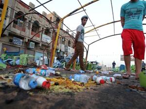 Iraq has been plagued by sectarian violence in 2013, with over 1,000 people dying in July alone. Here, Iraqis inspect the site the day after a bombing attack near a funeral tent that killed at least 56 in the Sadr City district of Baghdad on September 22, 2103. (AFP)