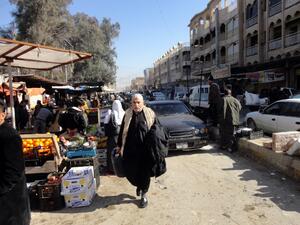 Despite the chaos engulfing Anbar province, life must go on as normal for many residents. Here, Iraqi traders sell their goods at an open air market in the center of the city of Fallujah, west of the capital Baghdad on January 8, 2014 (AFP)