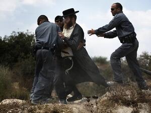 Extremist right-wing settlers from Yitzhar clashed with Israeli security forces over the destruction of illegally built homes. (AFP/File)