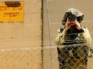 An Israeli soldier looks into Lebanon. The army has vowed to strongly respond to any Israeli aggression. (AFP/File)