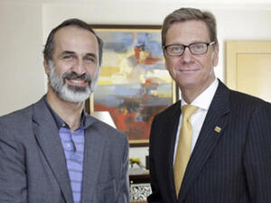 Moaz al-Khatib with the German foreign minister in Cairo.