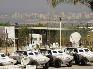 Vehicles of the United Nations Interim Force in Lebanon (UNIFIL) are parked at the Turkish engineering construction company's base on August 10, 2013 in the southern Lebanese village of Saitah. (AFP/MAHMOUD ZAYYAT)