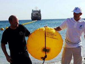 Peter Rubeck and Tore Solberg cut first buoy in landing ceremony