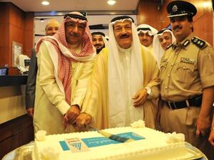 Sheikh Mohammed Al-Sabbah, Chairman of KIB and Abdulhameed Al Hajji, Governor of Farwaniya cutting the cake