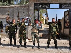 The United Nations on Monday announced that the Geneva II Syria peace conference - which aims to bring together the government and opposition - is set to be held on January 22, 2014. In this handout picture released by the official Syrian Arab News Agency (SANA) on November 15, 2013, soldiers loyal to the regime posing with their weapons. (AFP)
