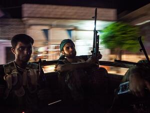 Syrian rebels head to the town of Bsankol in the northwestern province of Idlib to join comrades fighting regime forces for the control of the highway that connects Idlib with Latakia on July 11, 2013. (AFP)